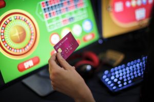 Woman Playing Online Roulette Holding Credit Card