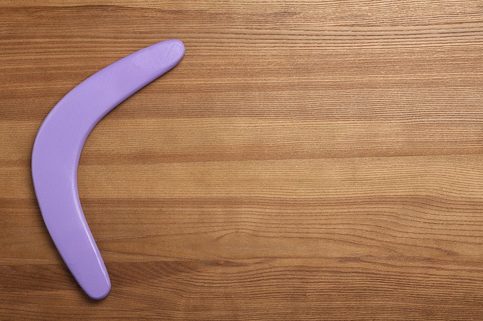 Purple Boomerang Wooden Background