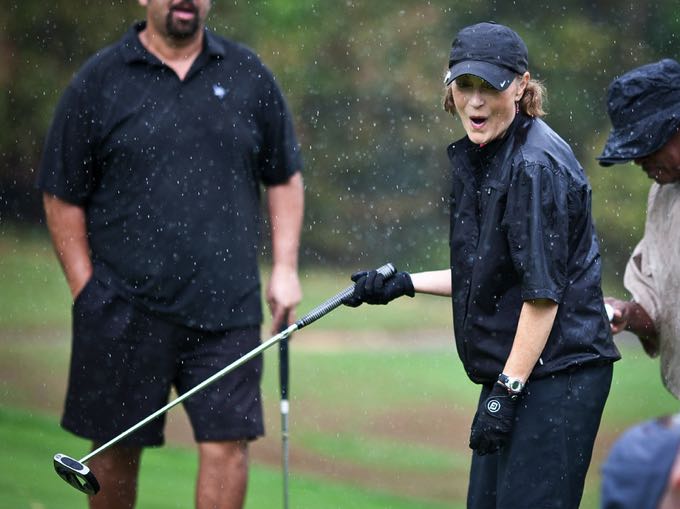 Playing golf in the pouring rain